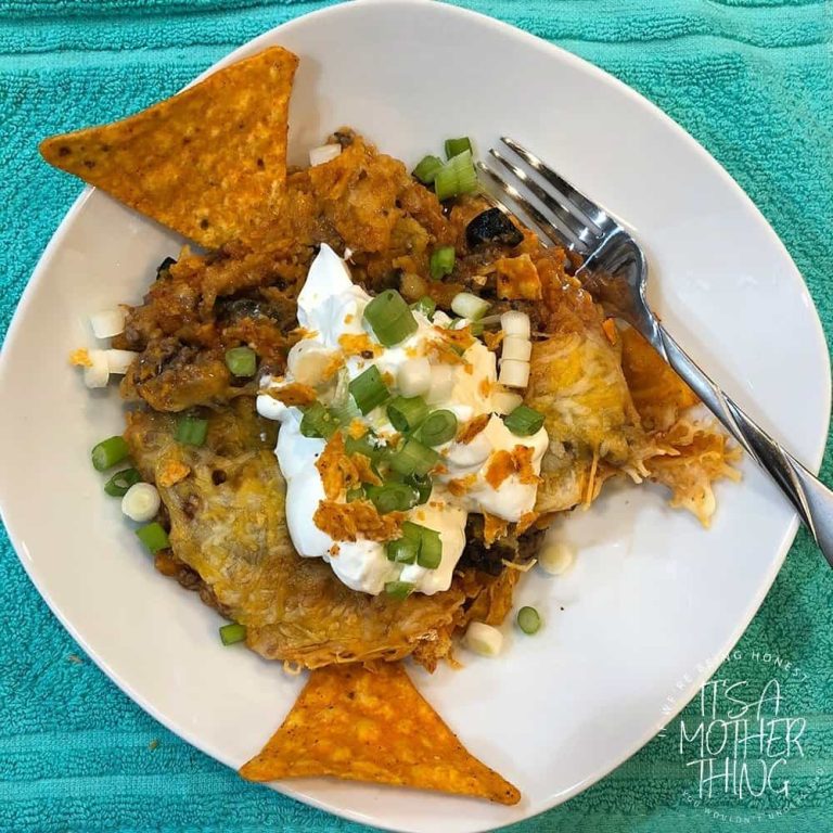 Layers of Doritos, meat, cheese, onions, olives and enchilada sauce make these "fake" enchiladas a delicious and simple family meal.