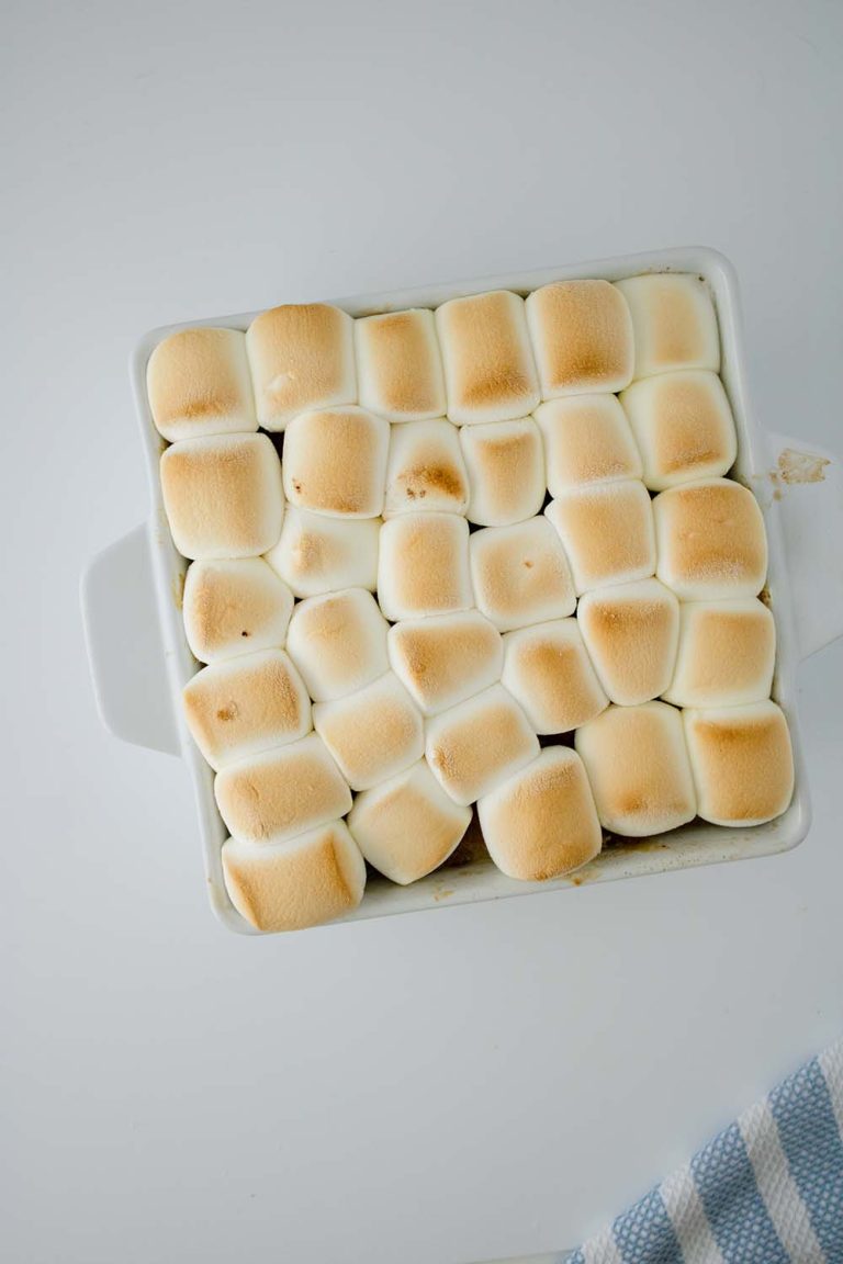 a tray of baked sweet potato casserole is waiting to be eaten